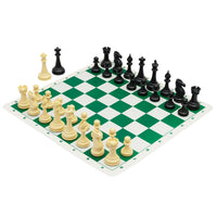 Best Chess Set Ever 4X set up on the green side of the silicone board, with the two extra queens beside it