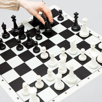 The Best Chess Set Ever 3X set on the black and white side of the silicone board, ivory and black pieces with board notation