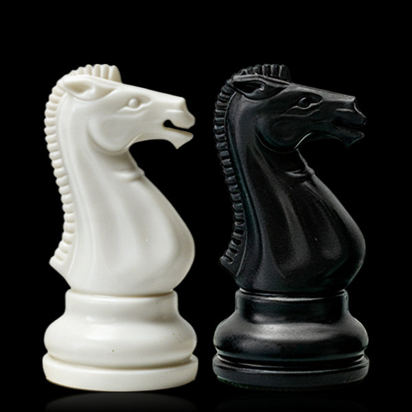 Best Chess Set Ever 3X ivory and black knights side by side on black