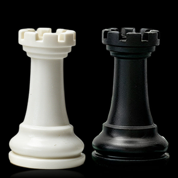Best Chess Set Ever 3X ivory and black rooks side by side on black