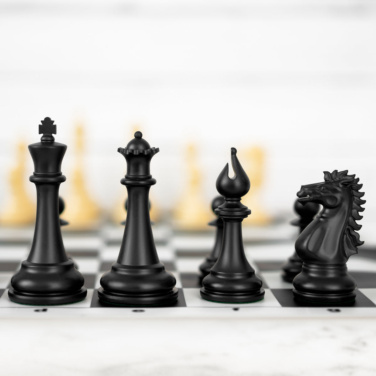 Black 4X king, queen, bishop and knight on the board